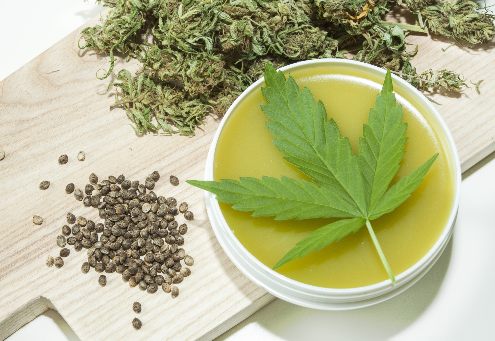 cannabis salve with leaf and seeds