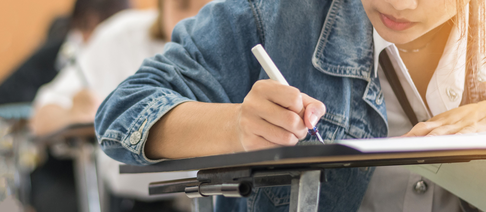 student taking exam in classroom