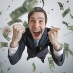 man with lots of money falling around him