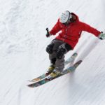 person skiing on steep slope