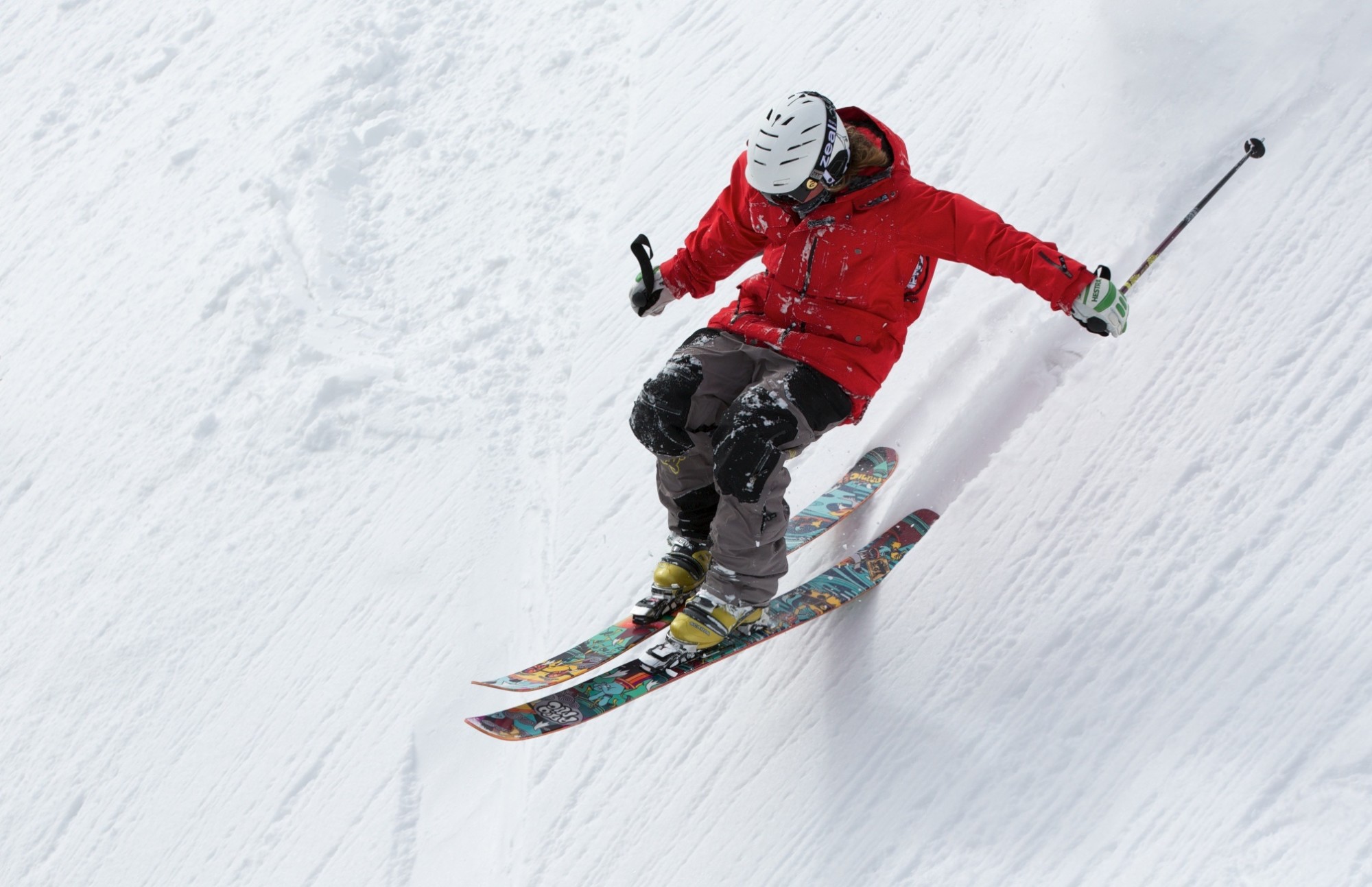 person skiing on steep slope