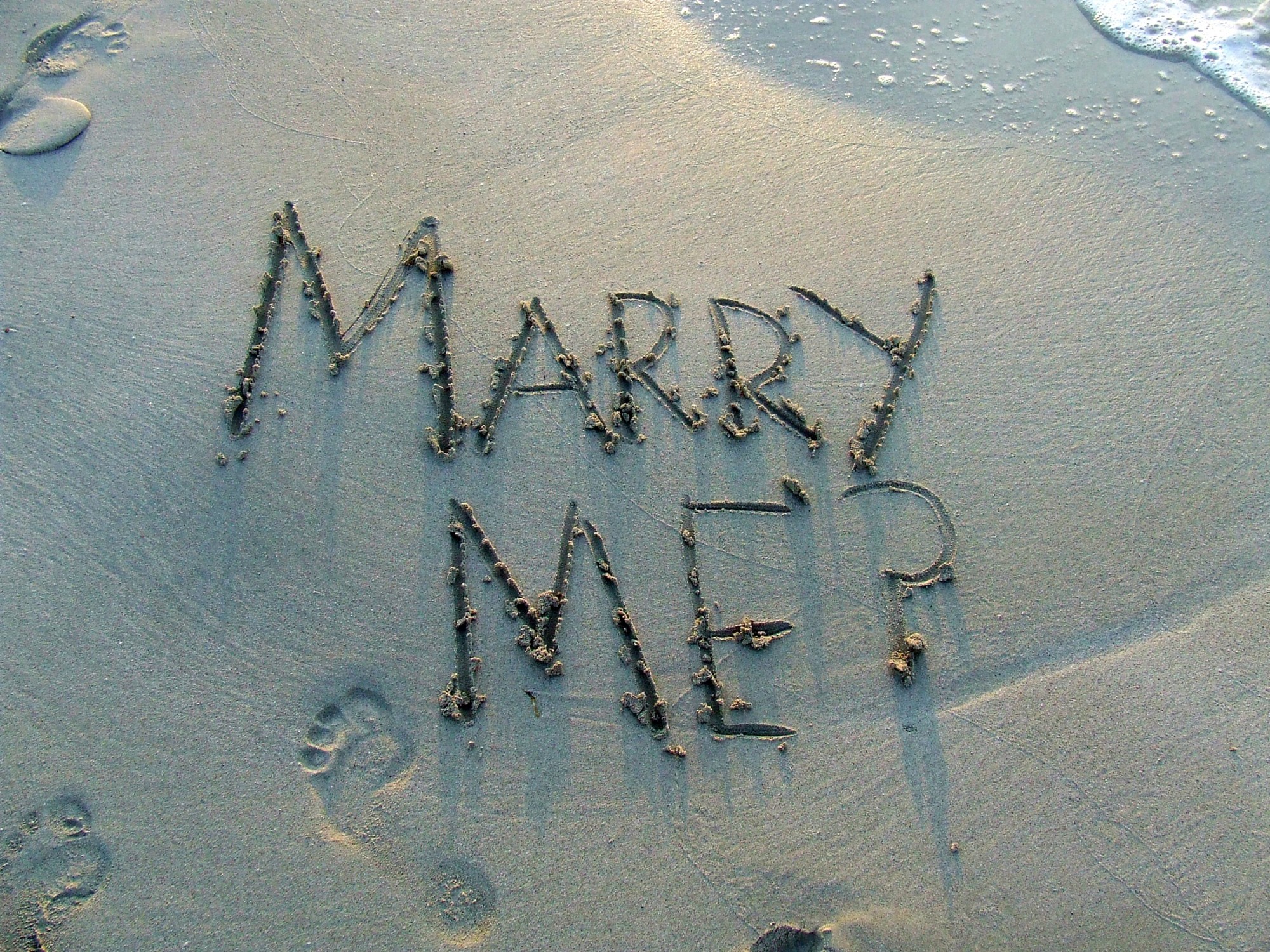 marry me written in sand