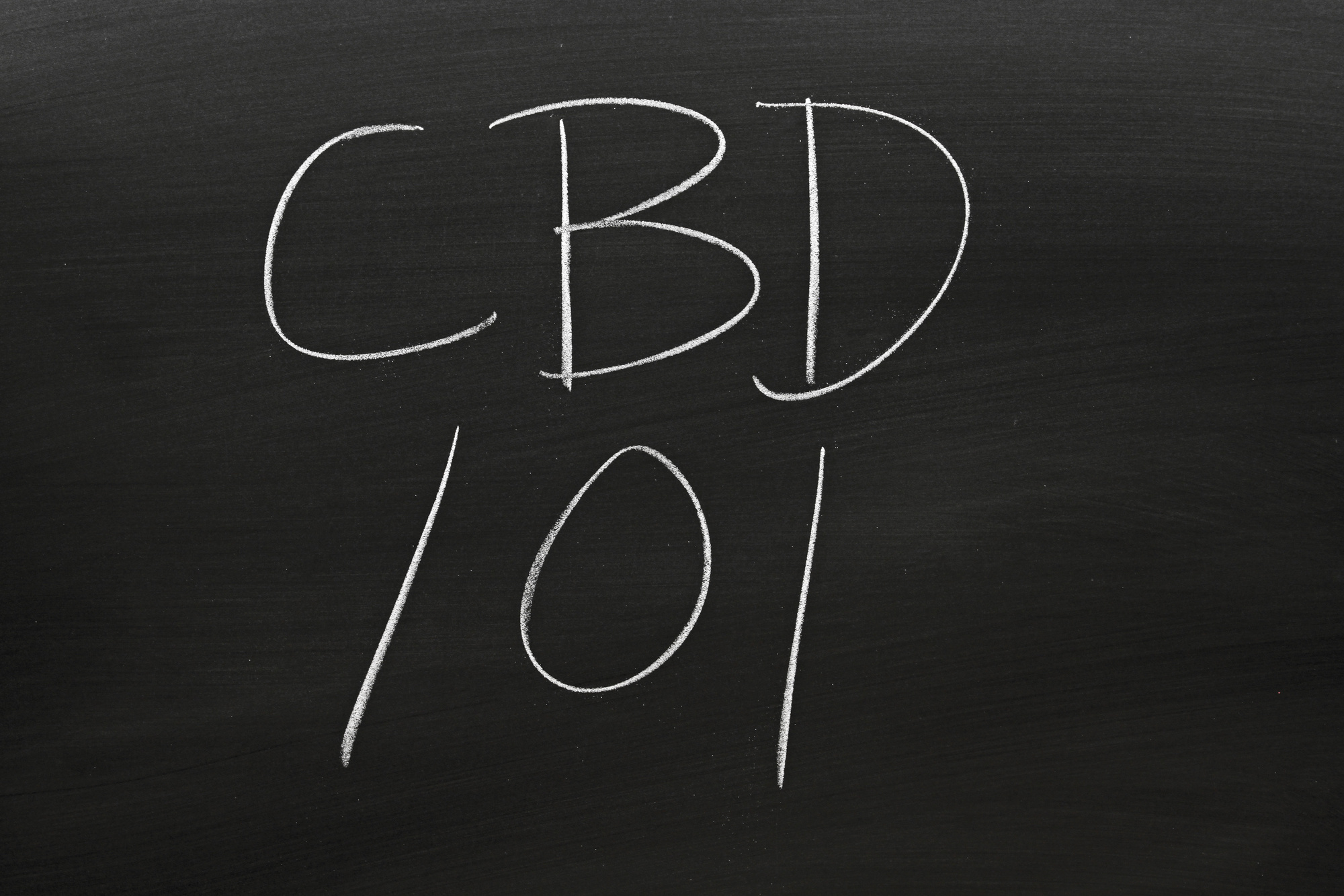 The words "CBD 101" on a blackboard in chalk