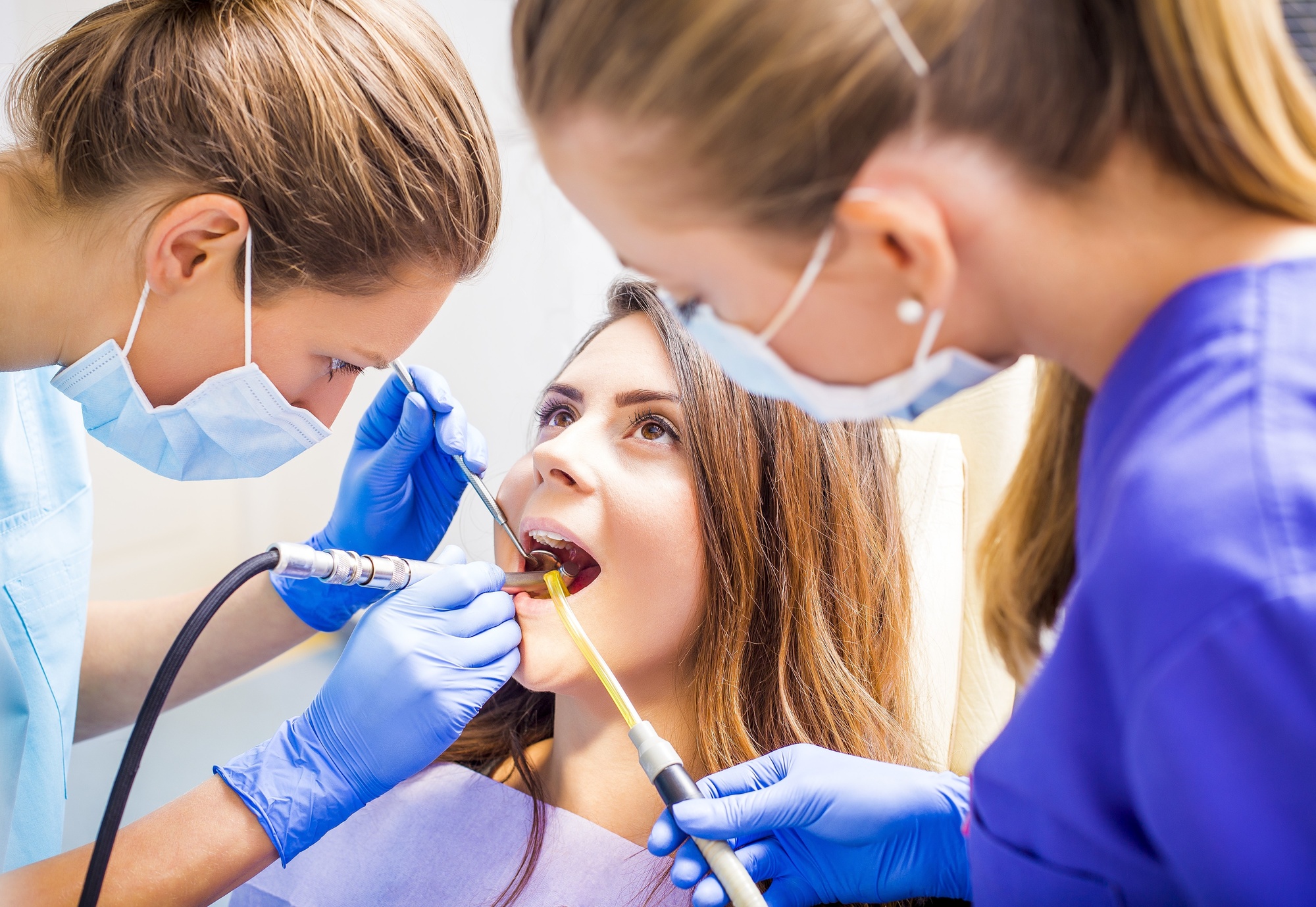 Woman Undergoing Dental Filling Procedure