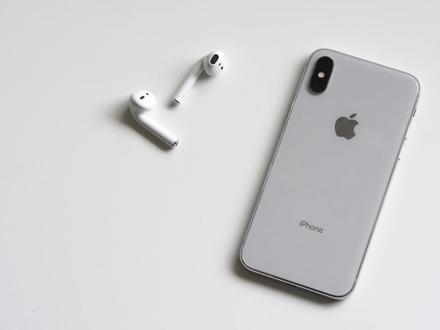 Airpods and an iPhone